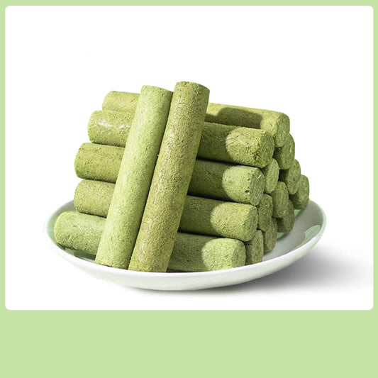 Green Cat Grass sticks on a white plate with text on a green background