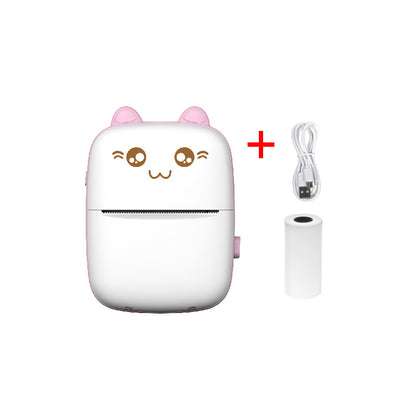 White electronic mini printer device with cartoon face and pink ears, including a cable and additional component on a white background.
